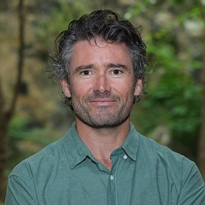 Contemporary man in casual wear outdoors, representing modern urban lifestyle and work-life balance.